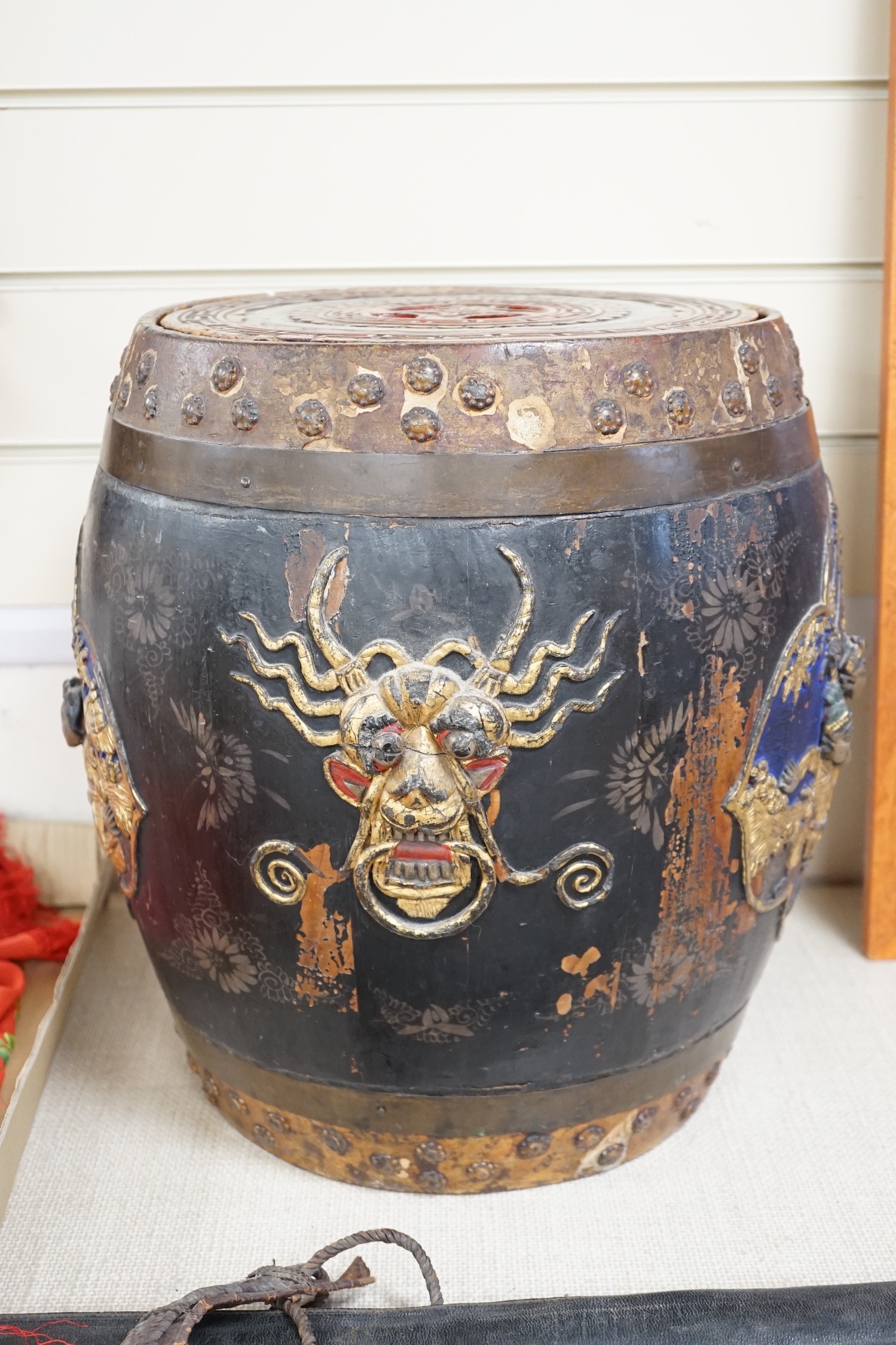 A Chinese lacquer decorated wood barrel form seat/storage container, 40cms high